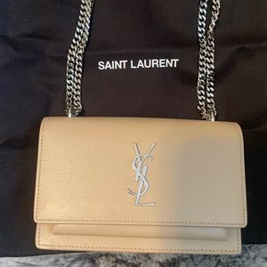Nude pink, can be worn as a shoulder or crossbody.